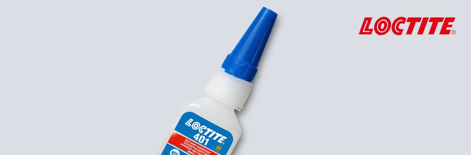 Loctite: Eine Flasche Sekundenkleber auf grauem Grund.