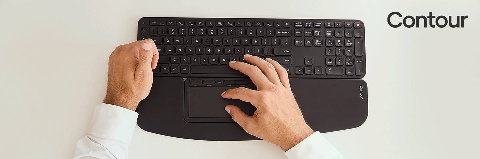 Contour Tastatur mit Handgelenkauflage und Trackpad von oben.