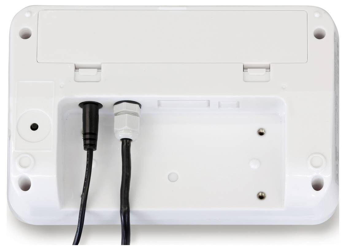 Pohled zezadu na bílé elektronické zařízení se dvěma připojenými kabely. Zařízení má kryt se dvěma panty.