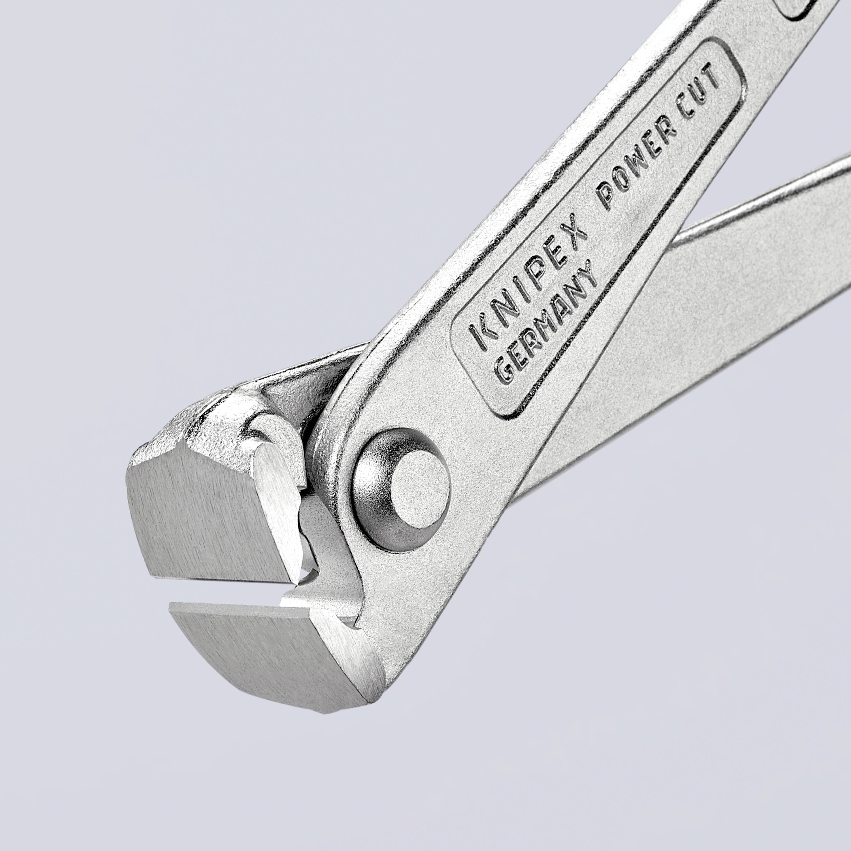 Stříbrné kleště s nápisem 'Knipex Germany Power-Cut'; zobrazují řezné hrany a část rukojeti.