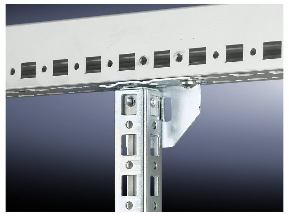 Kovový nosník s čtvercovými otvory je připojen k vertikálnímu trámu. Pozadí je tmavě modré.