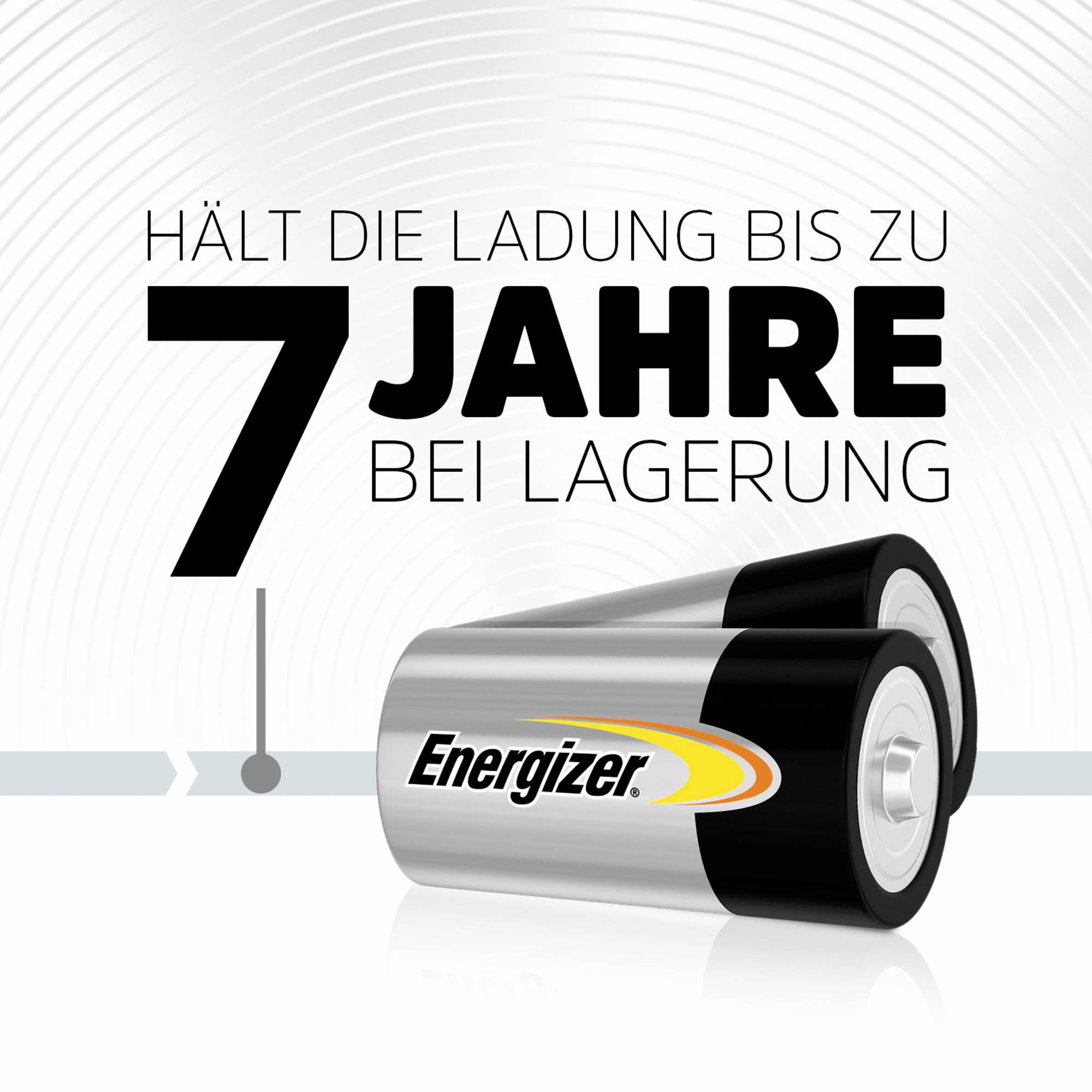 Dvě baterie Energizer vedle sebe. Text: 'Udrží náboj až 7 let při skladování'. Pozadí s kruhovým vzorem.