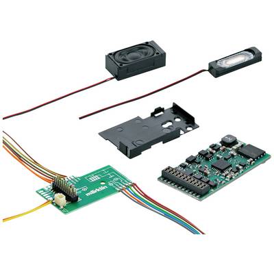Elektronický stavebnicový komplet s různými komponenty: deska plošných spojů, reproduktor, kabely a části krytu, vhodný pro vývoj technických projektů.