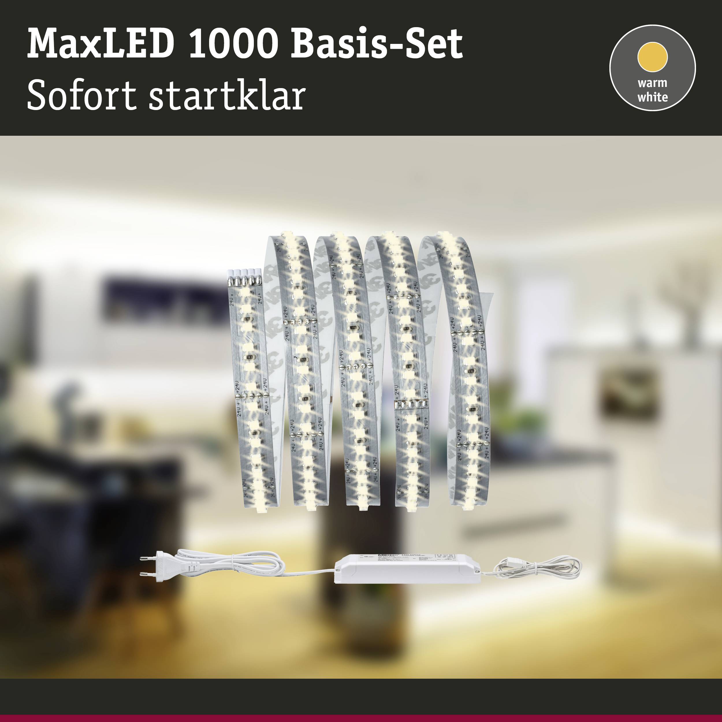 Sada MaxLED 1000 Basis, okamžitě připravená k použití, s teple bílým LED páskem pro osvětlení v moderním, rozostřeném pozadí místnosti.