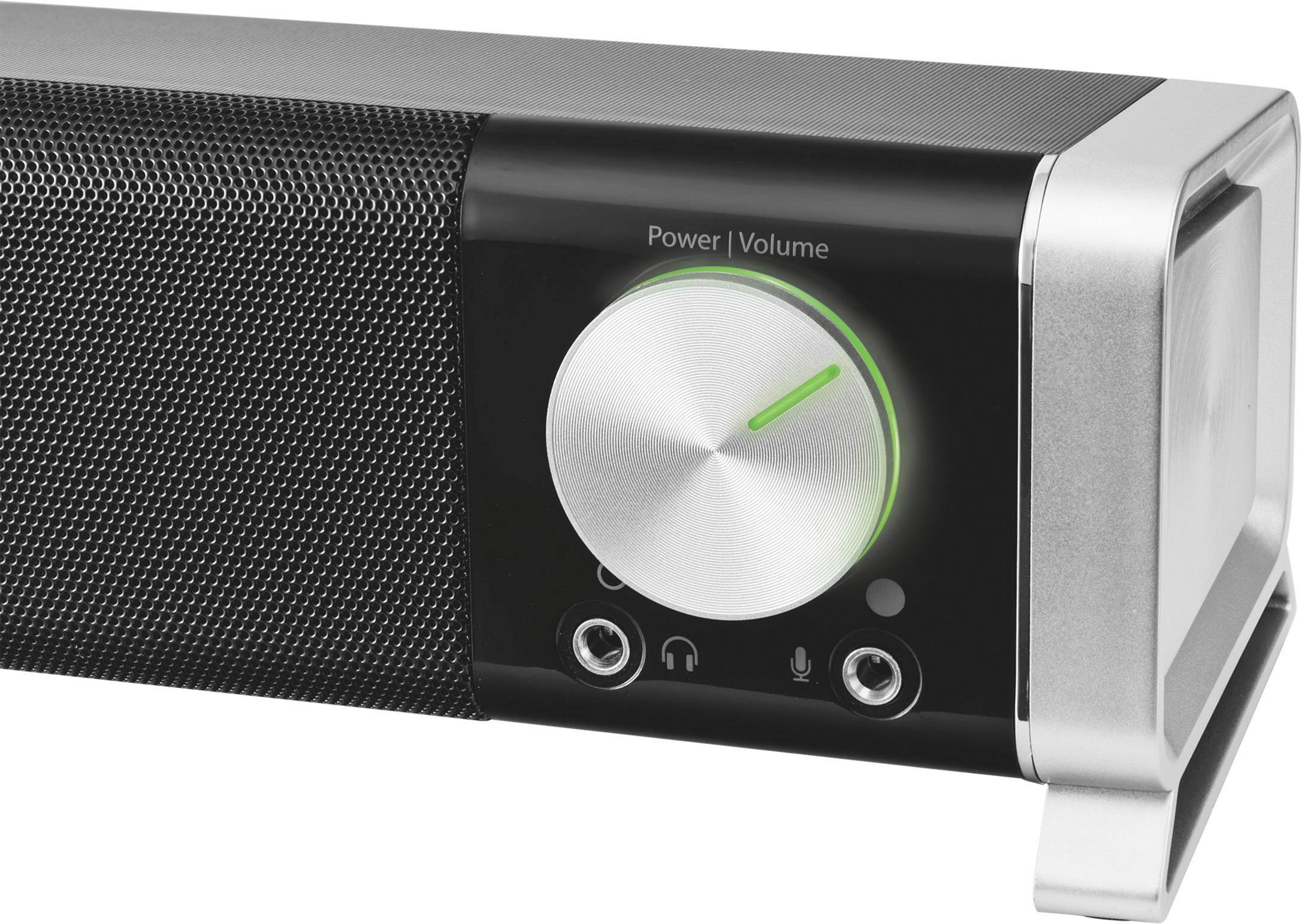 Stereo reproduktory s velkým stříbrným ovladačem hlasitosti a zelenou indikační LED, vedle nichž jsou dva 3,5mm konektory.