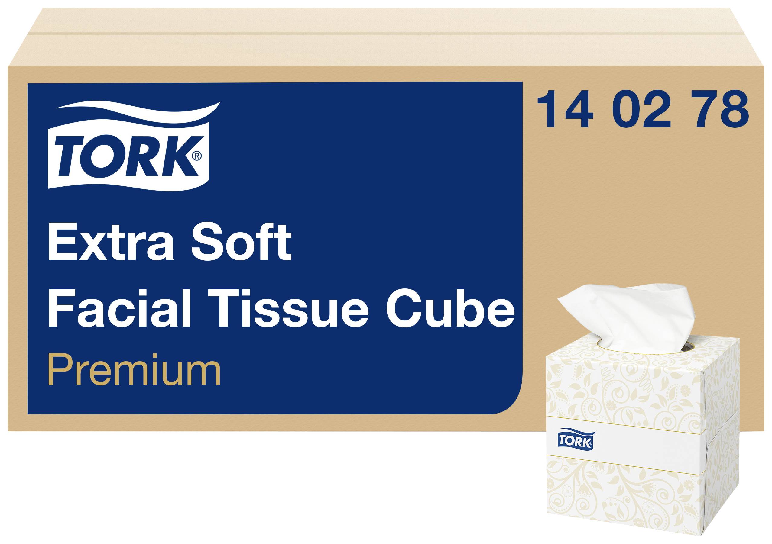Karton s kostkovou krabičkou papírových kapesníků Tork Extra Soft Facial Tissue Cube Premium a zobrazená krabička kapesníků.