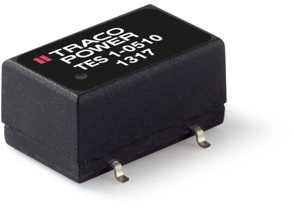 Černý transformátor Traco Power s nápisem 'TES 1-0510 1317'. Dva kovové kontakty dole pro elektronické připojení.