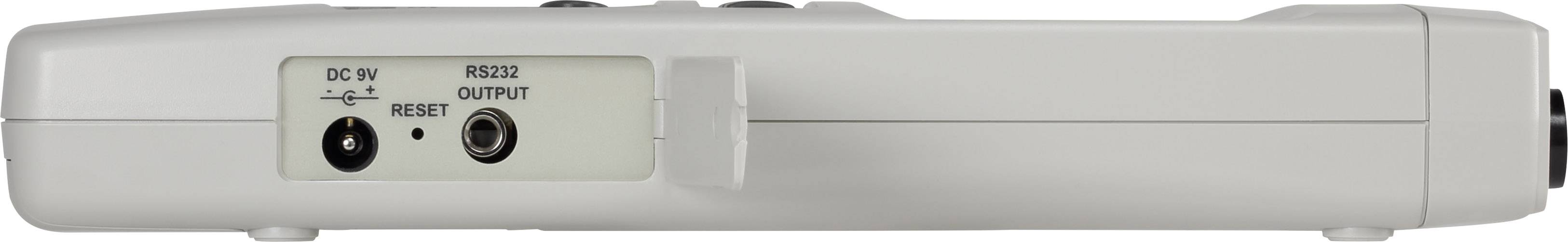 Bílé zařízení s konektory pro DC 9V a výstup RS232 na zadní straně.