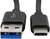 Dva USB konektory: vlevo USB-A konektor s modrou lištou, vpravo USB-C konektor. Oba černé s krátkými kabely.