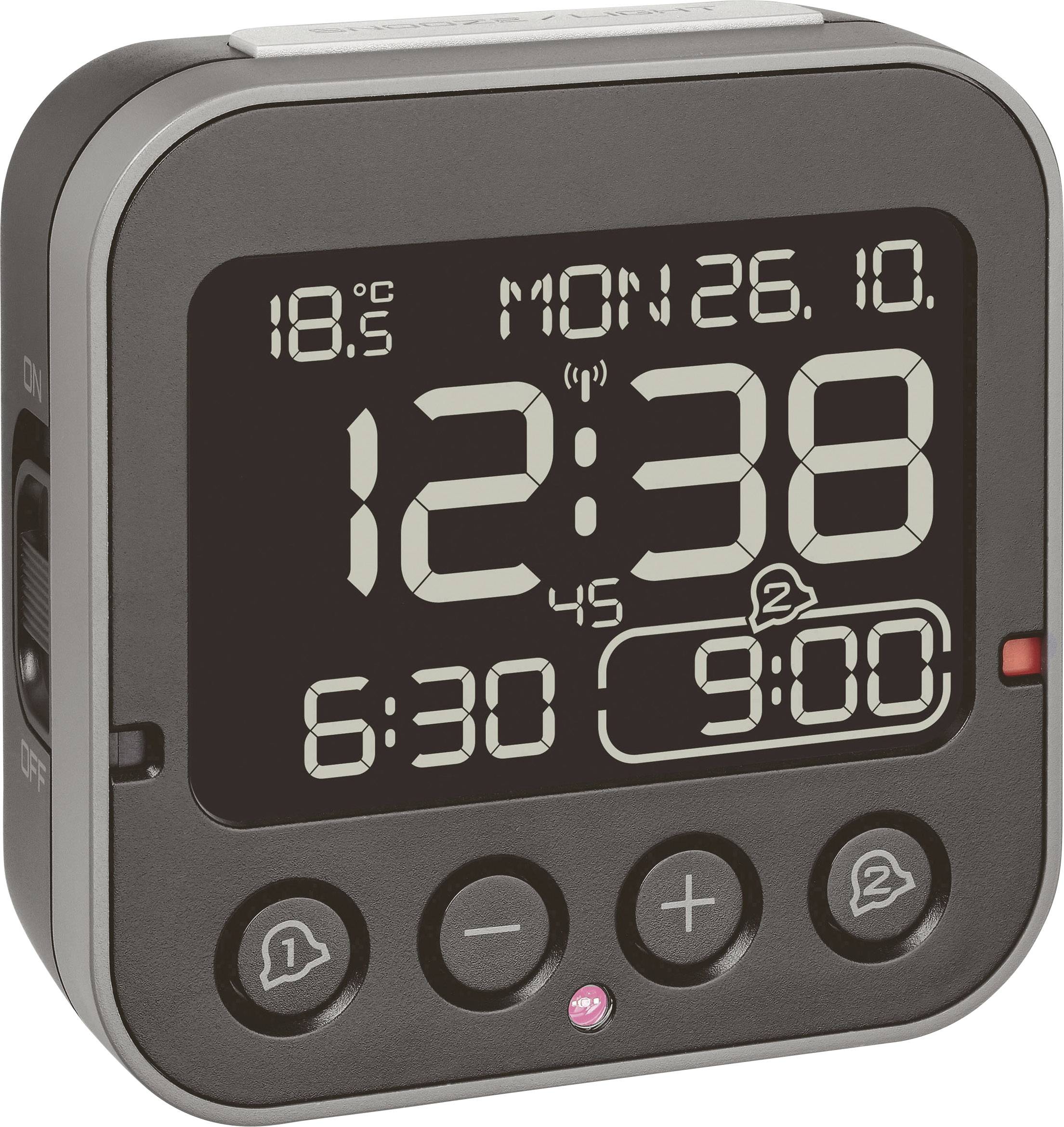 Digitální budík ukazuje čas 12:38, datum 'Po 26.10.' a vnitřní teplotu 18,5°C. Nastaveny dva budíky na 6:30 a 9:00.