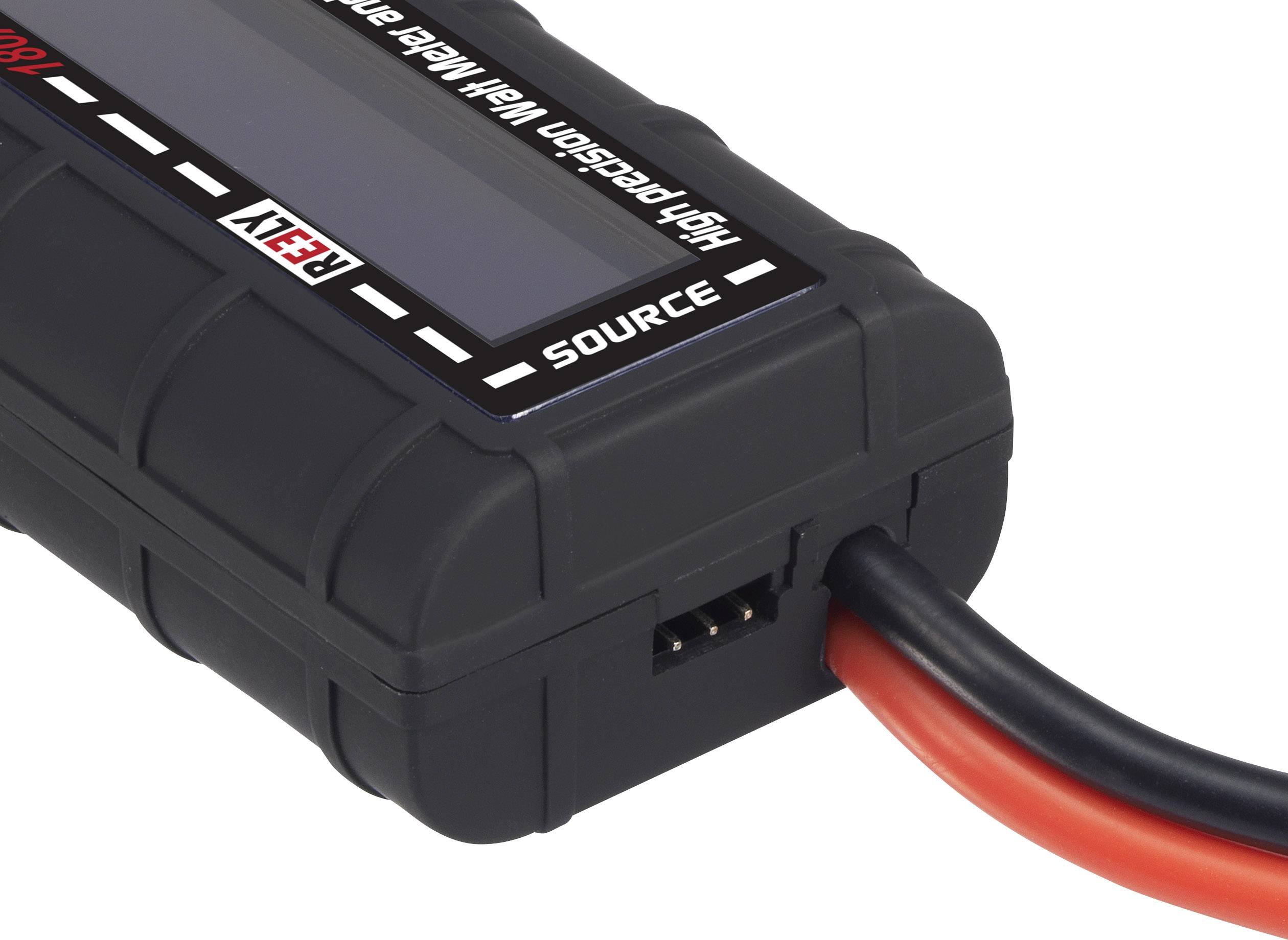 Černé elektronické zařízení se dvěma kabely. Viditelné nápisy 'High Precision' a 'Source'. Pravděpodobně měřicí přístroj.