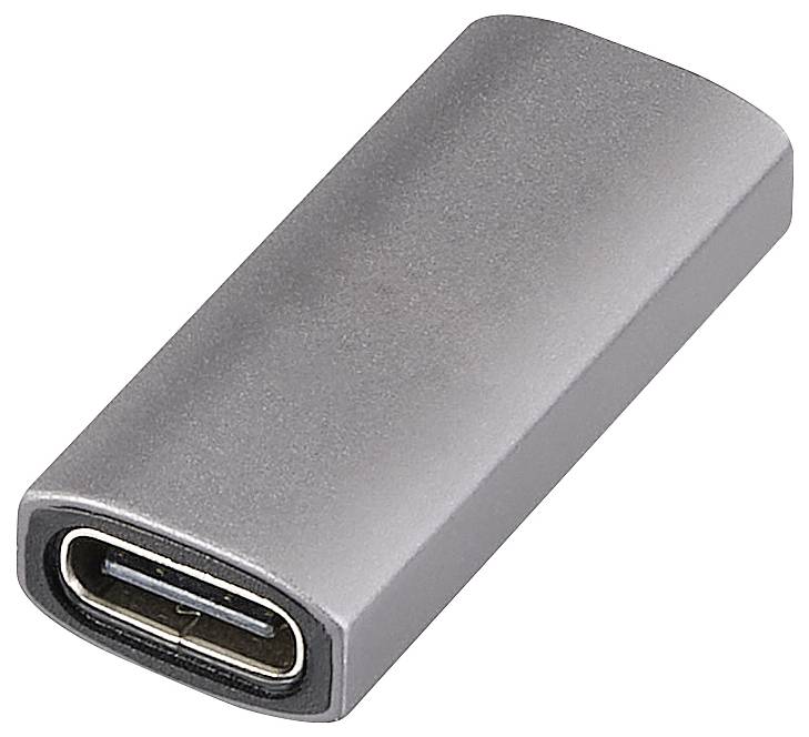 Stříbrný USB-C adaptér válcovitého tvaru, který se používá pro připojení k elektronickým zařízením.