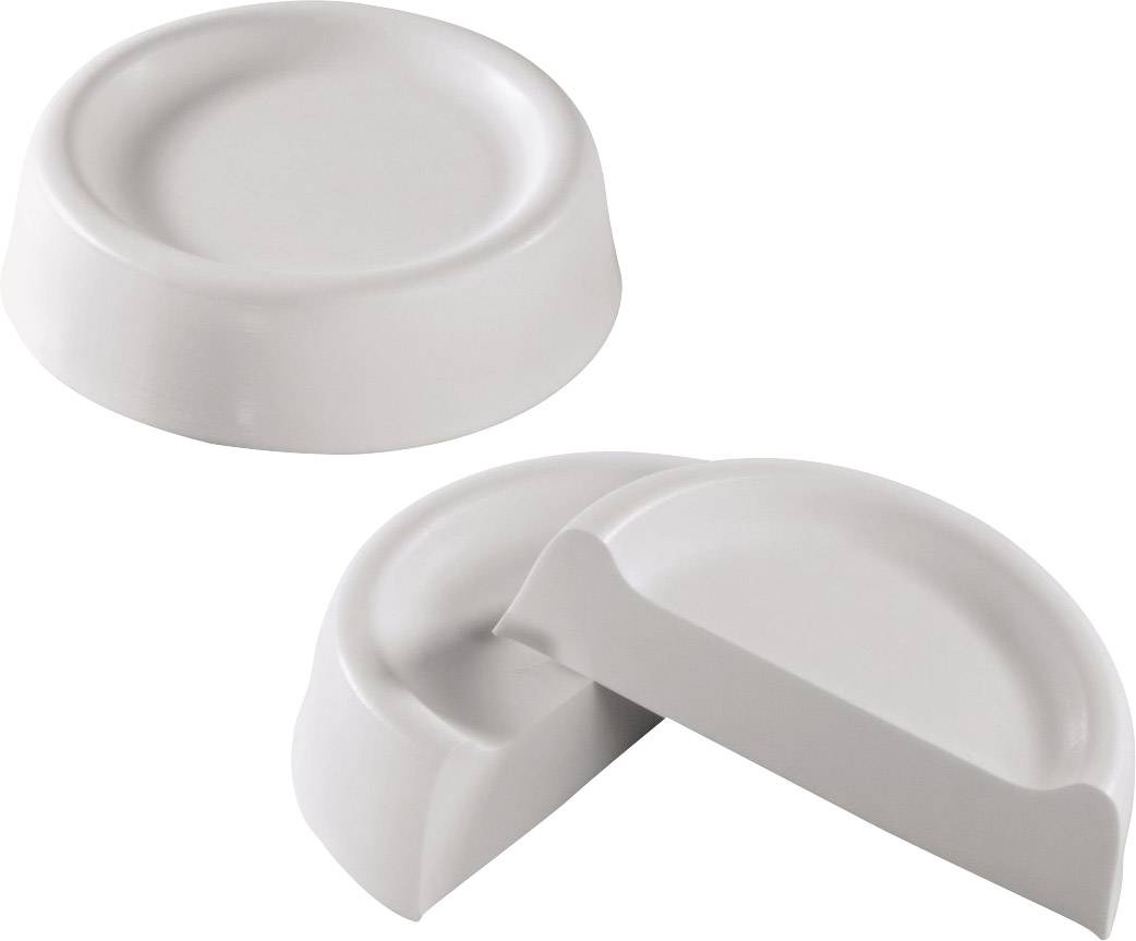 Dva kulaté, ploché zarážky dveří z bílého plastu, jedna neporušená a jedna rozlomená na dvě poloviny.