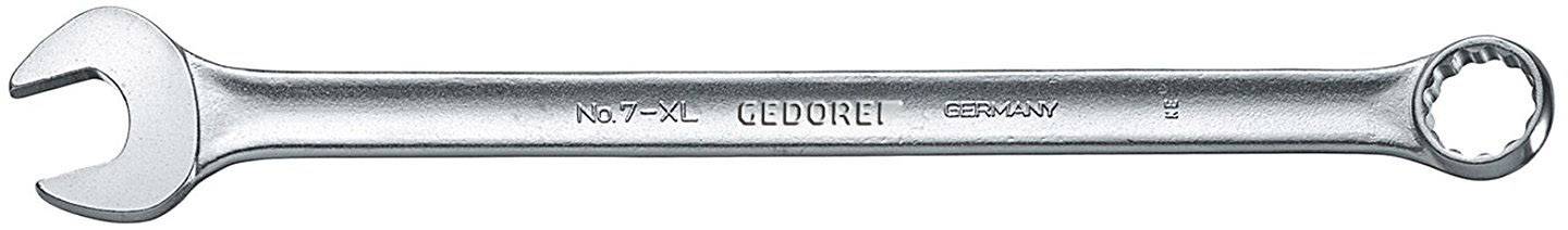 Stříbrný klíč s otevřeným a kroužkovým koncem, na němž je vytlačeno 'GEDORE', leží vodorovně.