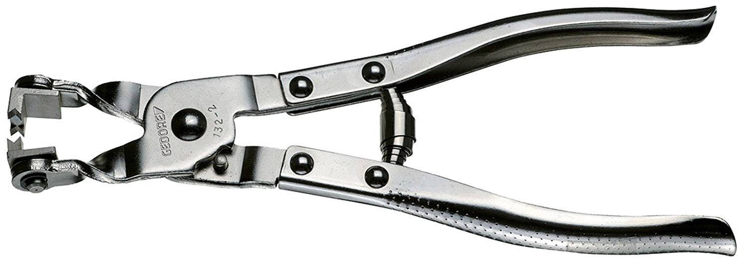 Kovové děrovací kleště s ergonomickými ocelovými rukojeťmi, vhodné pro vytváření pravidelných děr v kůži nebo textilních materiálech.