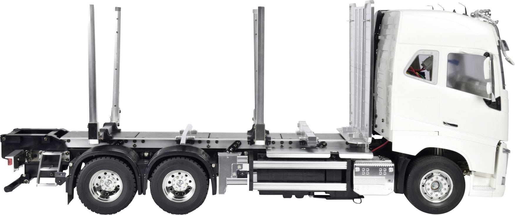 Bílý nákladní vůz bez přívěsu pohledem z boku, vhodný pro přepravu dřeva nebo kmenů.