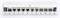 Patch panel se 12 porty, z toho sedm obsazeno. Číslování a popis štítků nad porty, volná místa jsou viditelná vpravo.