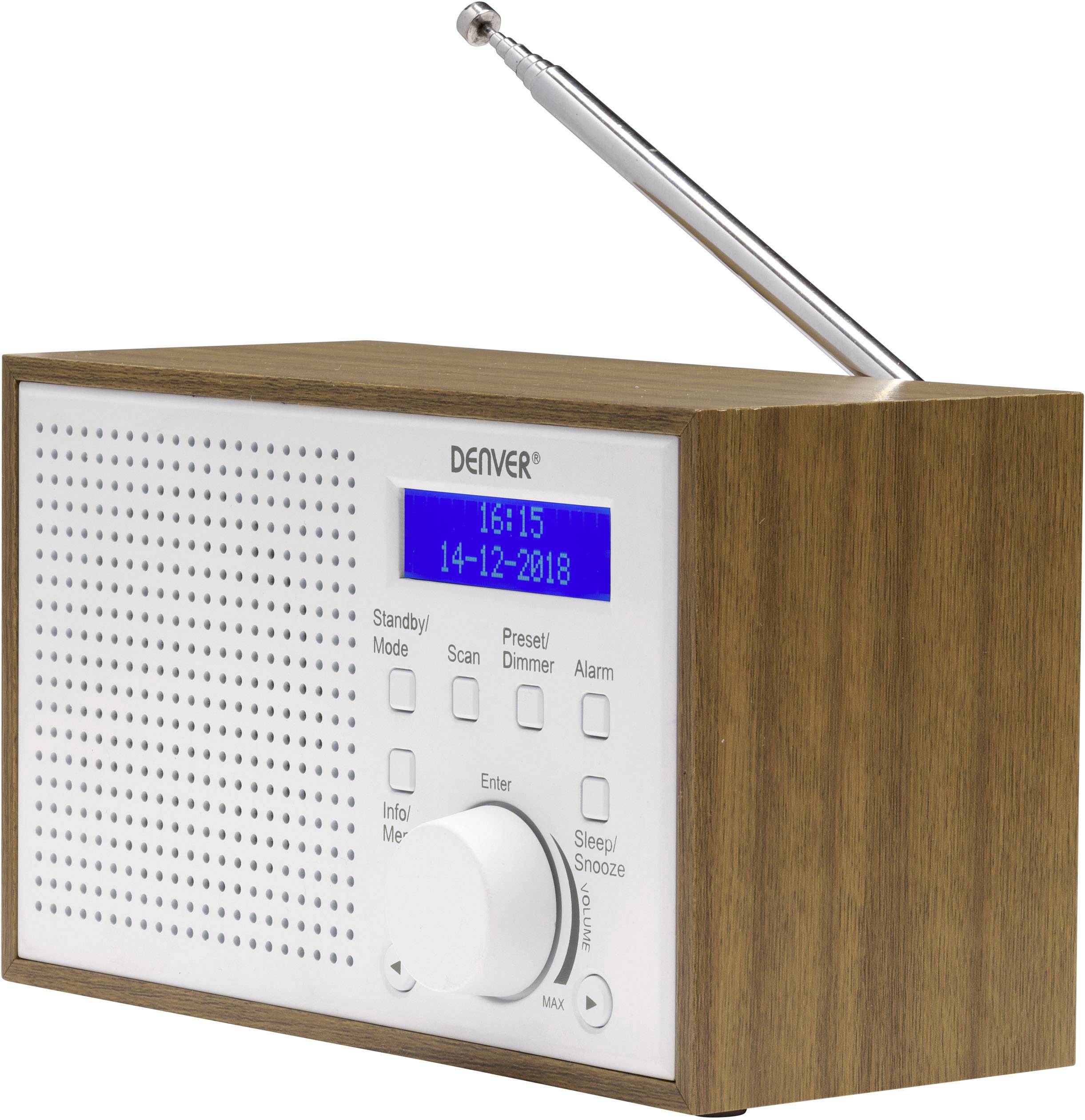 Dřevěné kostěné rádio s modrým displejem ukazuje '15:15, 14-12-2018'. Jsou viditelná různá tlačítka pro nastavení funkcí jako budík a hlasitost.