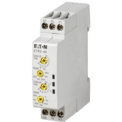 Šedé elektronické zařízení s tlačítky a přípojkami, označené štítkem 'EATON ETR2-44'. Používá se pro řízení času nebo spínání.