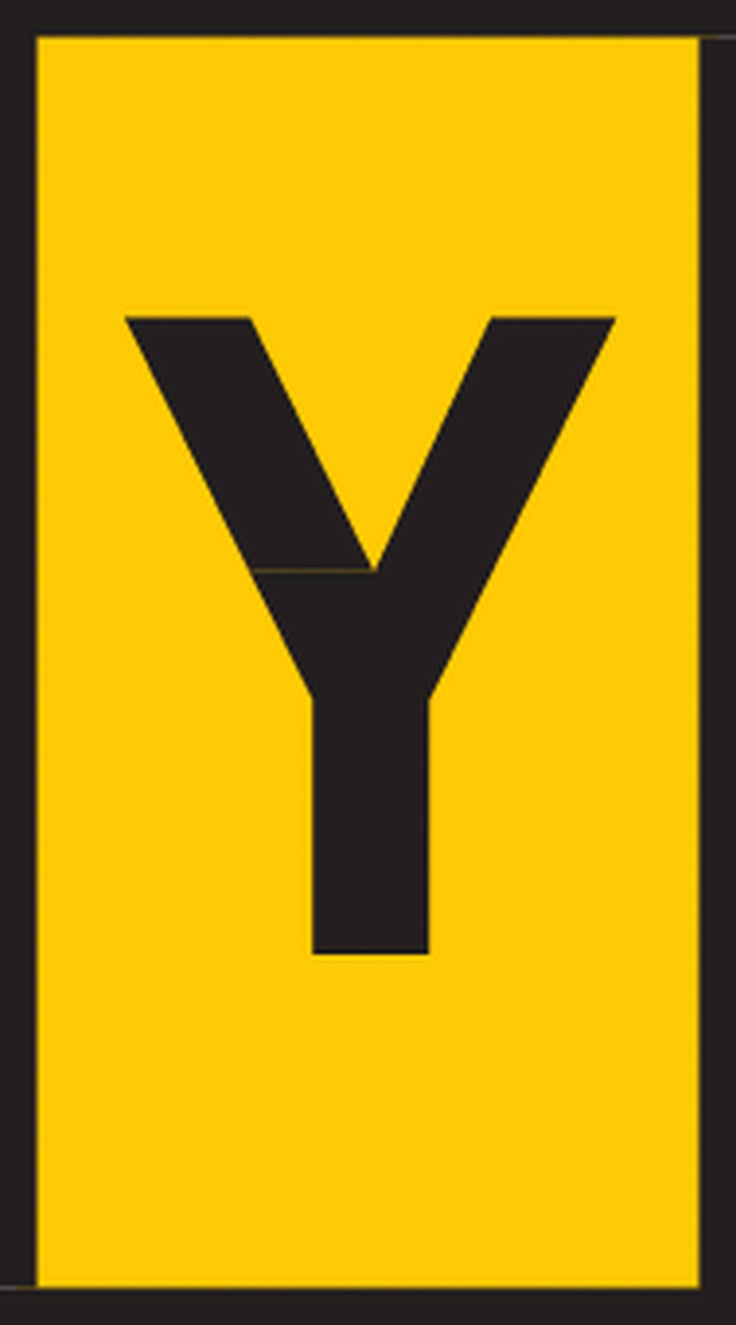 Žluté znamení s velkým černým písmenem 'Y' uprostřed.