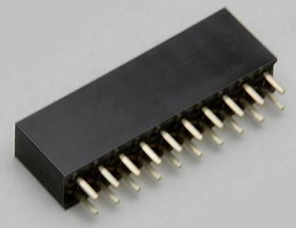Černý, obdélníkový elektronický prvek s několika zlatými kolíky vyčnívajícími na jedné straně, umístěný na šedém pozadí.