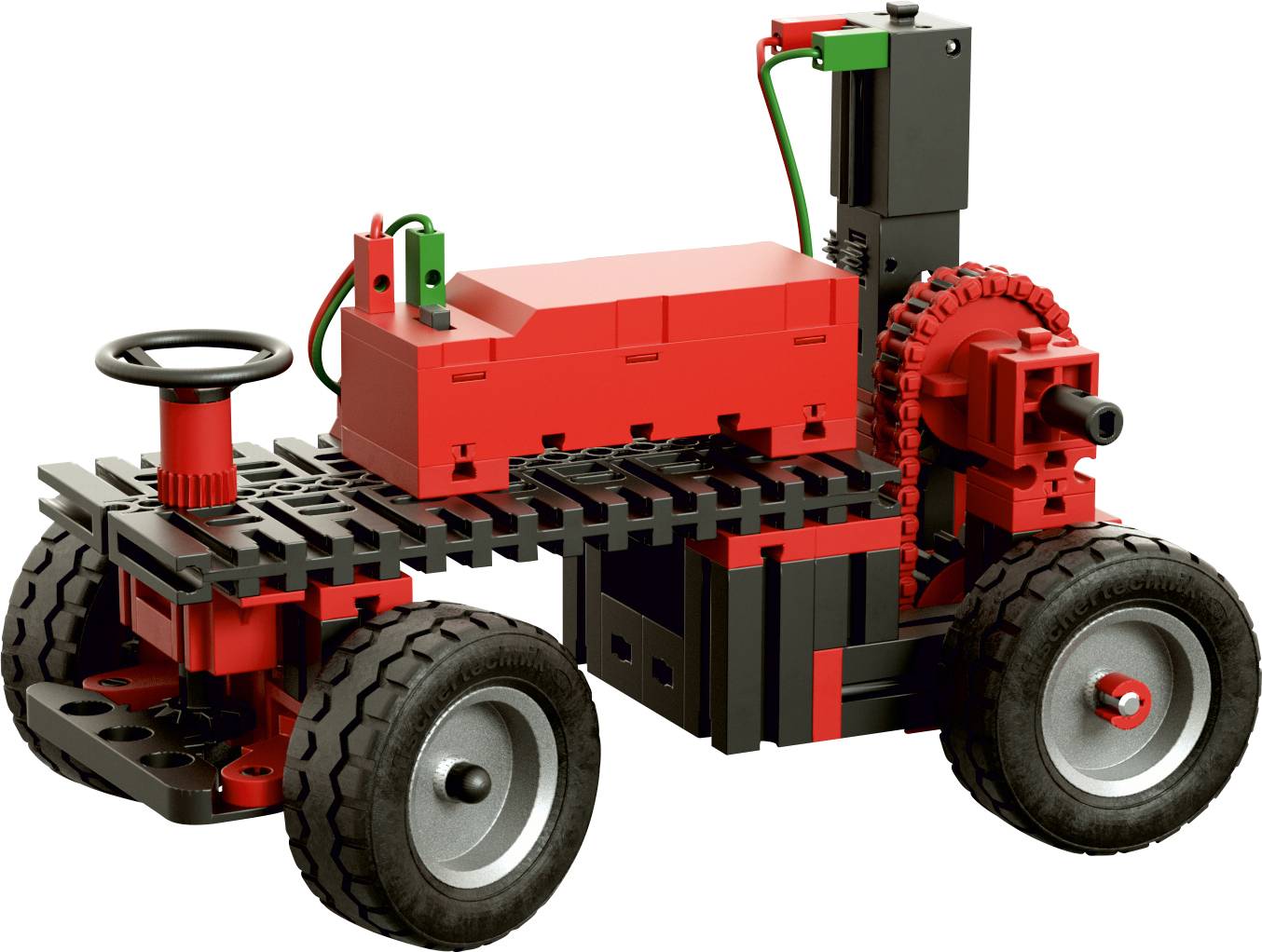 Malý modelový automobil ze stavebních dílků, převážně červené a černé barvy, se čtyřmi koly, viditelnými ozubenými koly a maketou volantu.