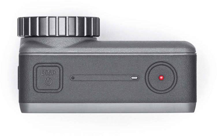 Kompaktní digitální fotoaparát pohledem shora, ukazující hlavní vypínač a spoušť.