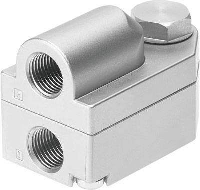 Stříbrný mechanický díl se dvěma připojovacími otvory pro trubky a válcovitou částí nahoře. Pravděpodobně hydraulický nebo pneumatický konektor.