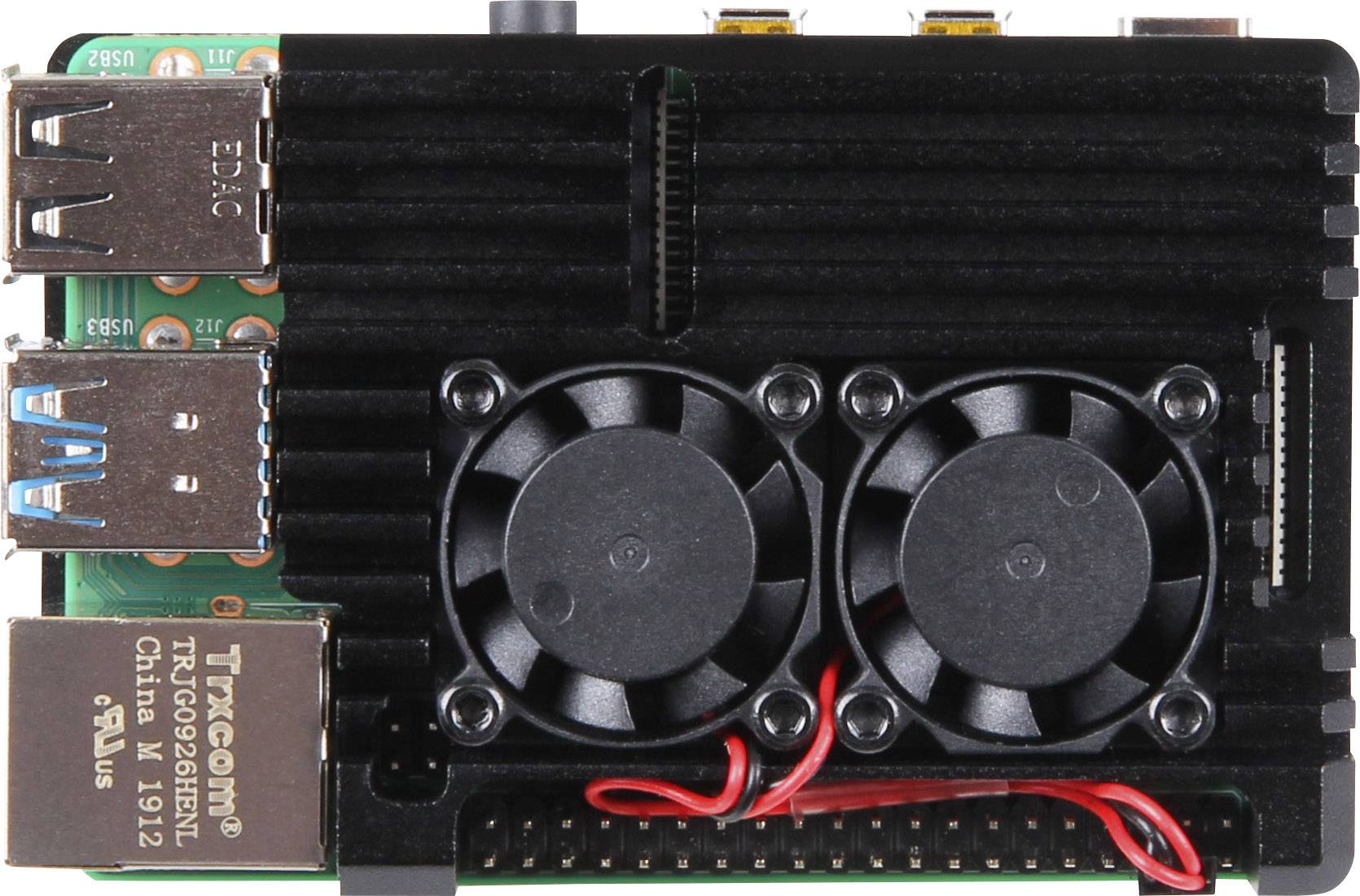 Malý počítač se dvěma ventilátory na základní desce. Na horní straně jsou USB porty, síťový port a nápis 'TARGO RJ-45'.