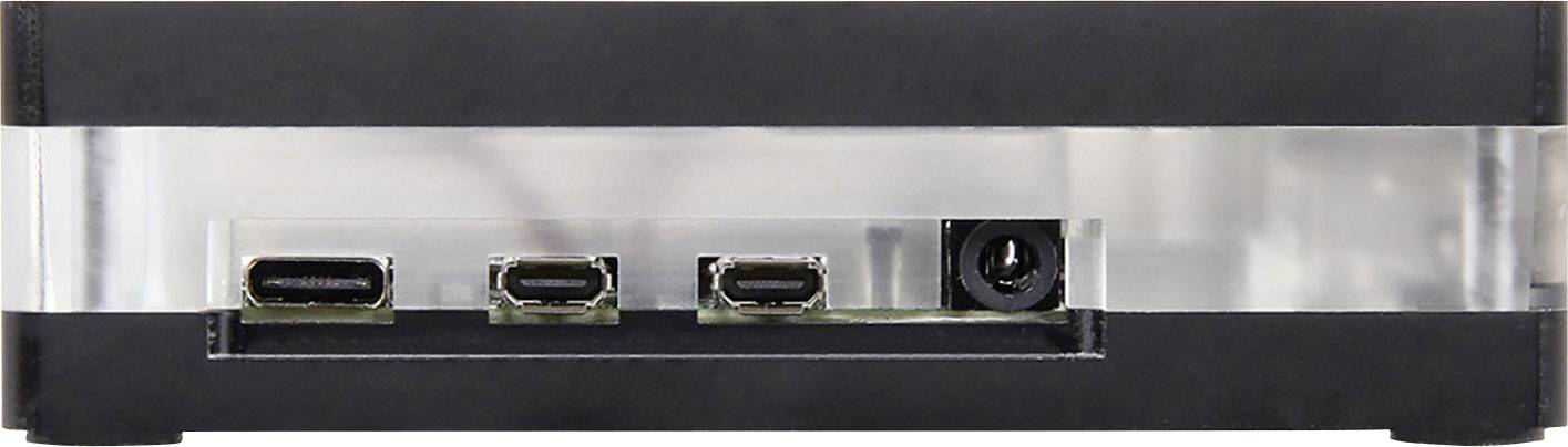 Malé černé elektronické zařízení se třemi USB-C porty a jedním vstupem pro stejnosměrný napájecí adaptér, pohled zezadu.