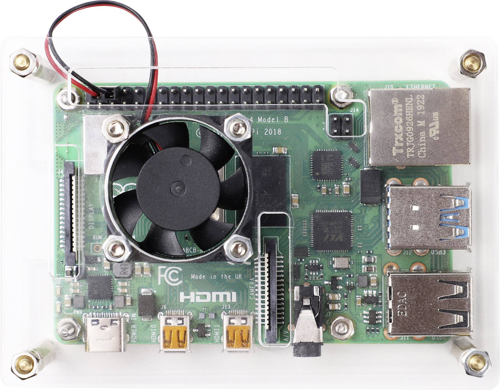 Malá zelená deska plošných spojů s ventilátorem a různými konektory, včetně HDMI a USB. Text na ní: 'HDMI' a 'Made in UK'.