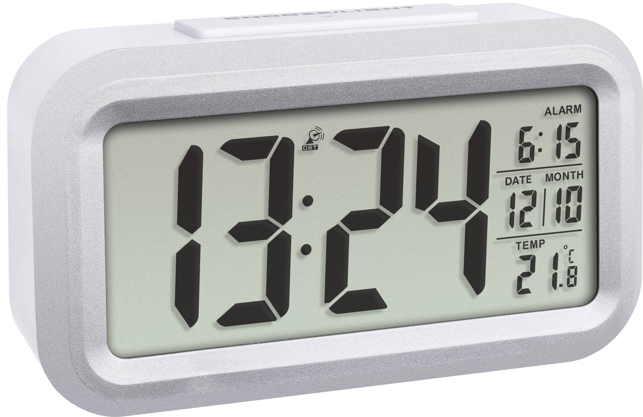 Elektronické hodiny ukazují 13:24, budík nastaven na 6:15, datum 12.10, teplota 21,8°C.