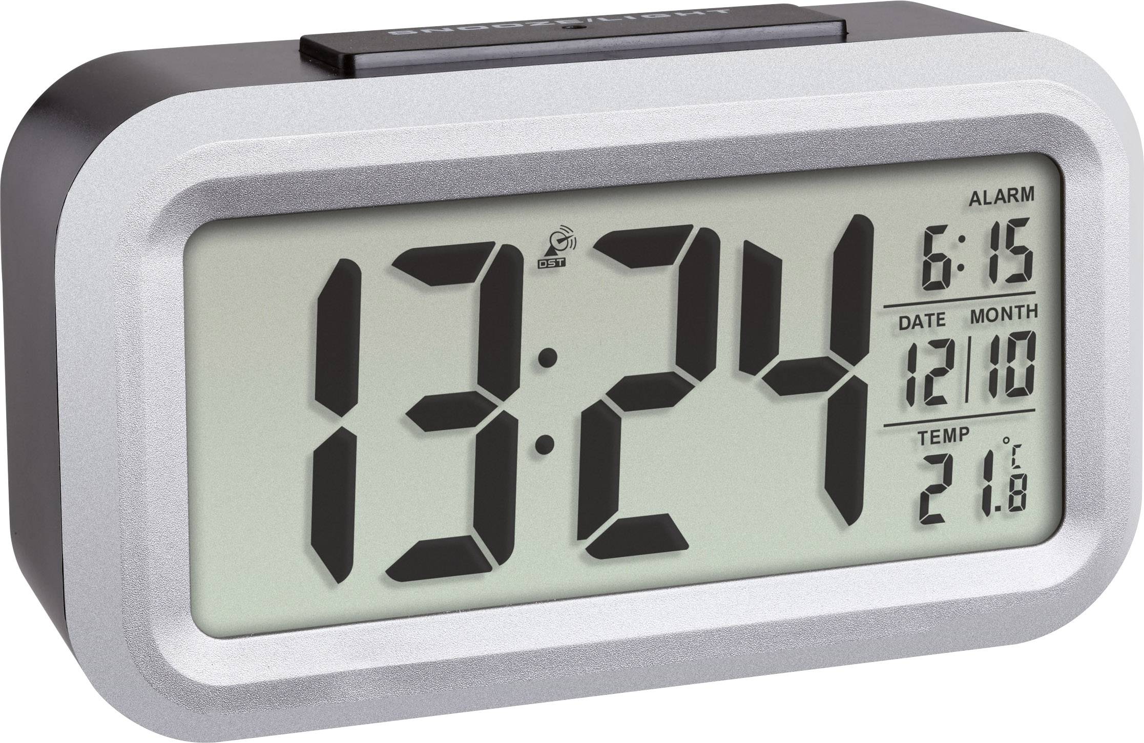 Digitální hodiny ukazují 13:24. Budík je nastaven na 6:15. Datum je 10. prosince. Teplota je 21,8 stupňů Celsia.