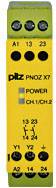 Žluté bezpečnostní relé s nápisem 'pilz PNOZ X7' a indikačními světly pro 'POWER' a 'CH1/CH2', čtyři páry svorkovnic nahoře.