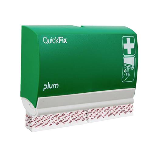 Zelené zařízení na náplasti 'QuickFix' s vytahovatelnou náplastí. Zobrazuje symbol bílého kříže, stojí na povrchu.