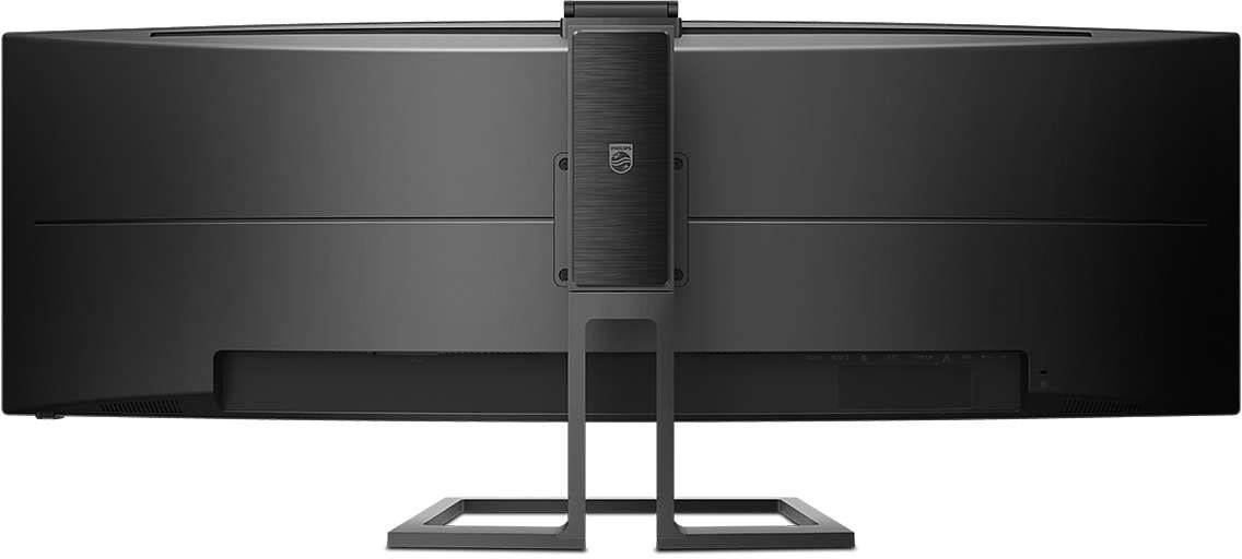 Pohled zezadu na černý ultraširoký počítačový monitor umístěný na obdélníkovém stojanu.