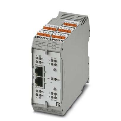 Šedý elektronický díl s několika přípojnými místy a konektory, stojící vertikálně, nabízející síťové a I/O porty.