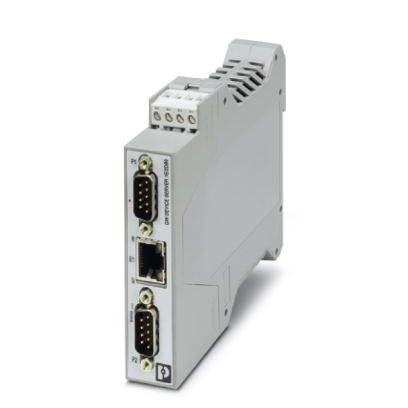 Šedý elektrický komunikační modul s několika porty, včetně ethernetového připojení a dvou rozhraní RS-232.