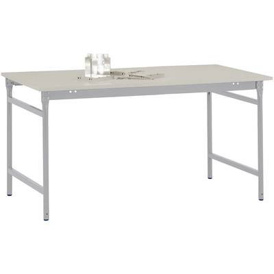 Obdélníkový, stabilní stůl s kovovými nohami a světlou deskou. Nahoře leží geometrické nástroje.
