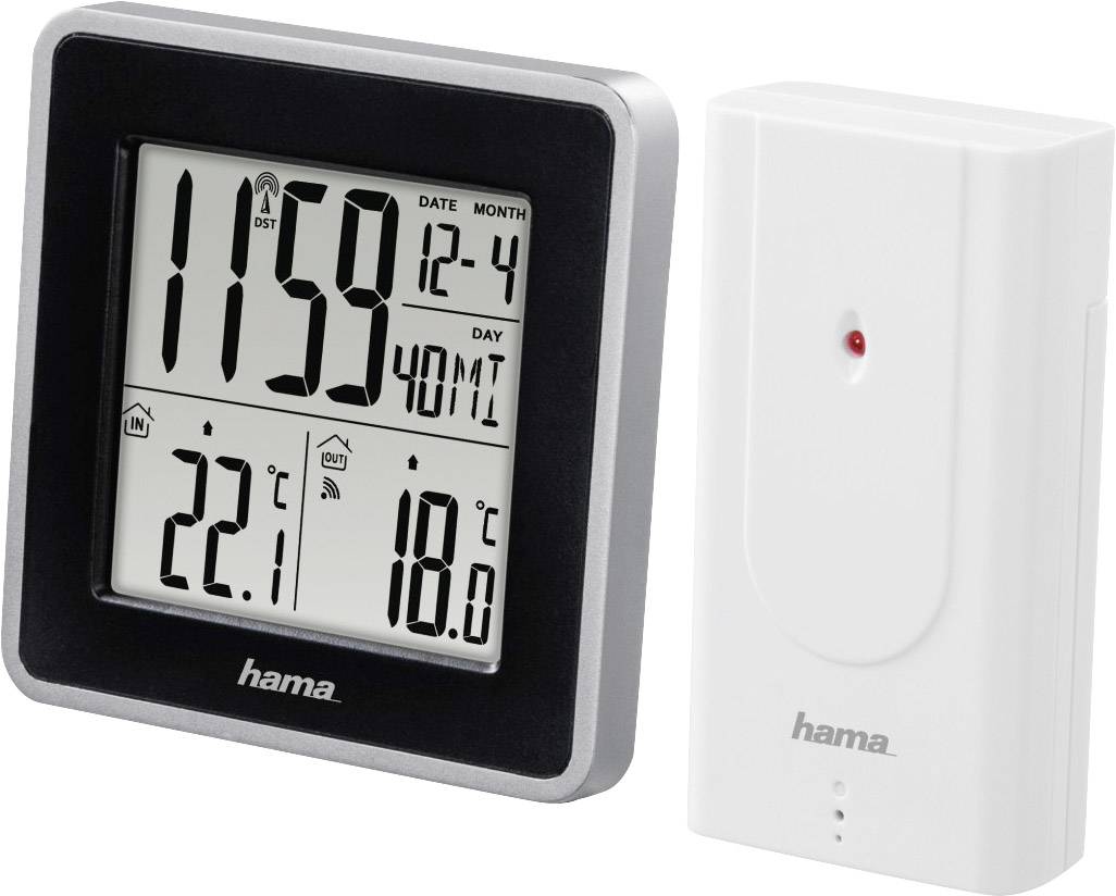 Černá digitální meteorologická stanice s displejem zobrazujícím čas, datum, vnitřní teplotu (22,1°C) a venkovní teplotu (18,0°C); bílý venkovní senzor.