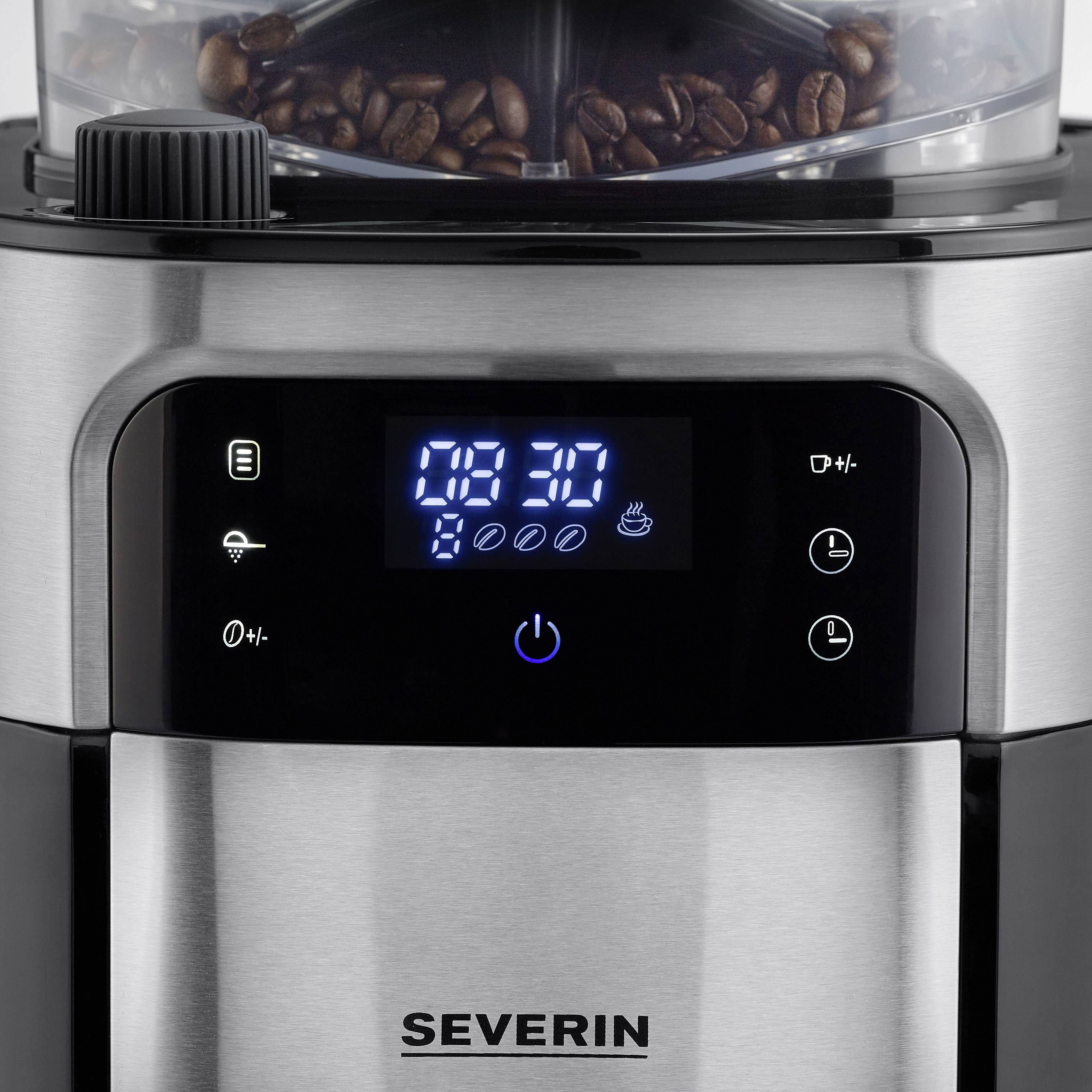 Espresso kávovar z nerezové oceli s digitálním displejem. Zobrazuje čas '09:30'. Čerstvé kávové zrna v průhledné nádobce nahoře.