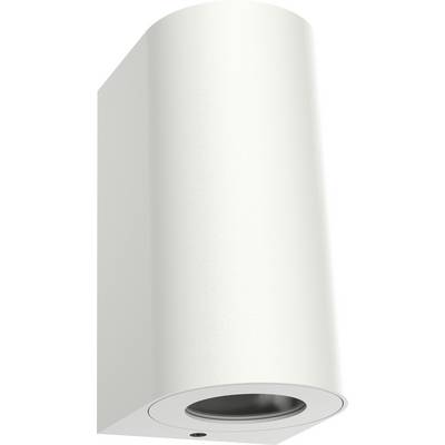 Bílá válcová nástěnná lampa se zdrojem světla směřujícím dolů, vhodná do moderních interiérů.