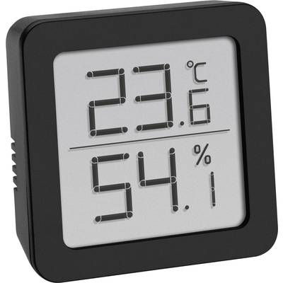 Digitální teploměr-vlhkoměr ukazuje '23,6°C' a '54%'. Černé, čtvercové pouzdro s displejem s velkými číslicemi.