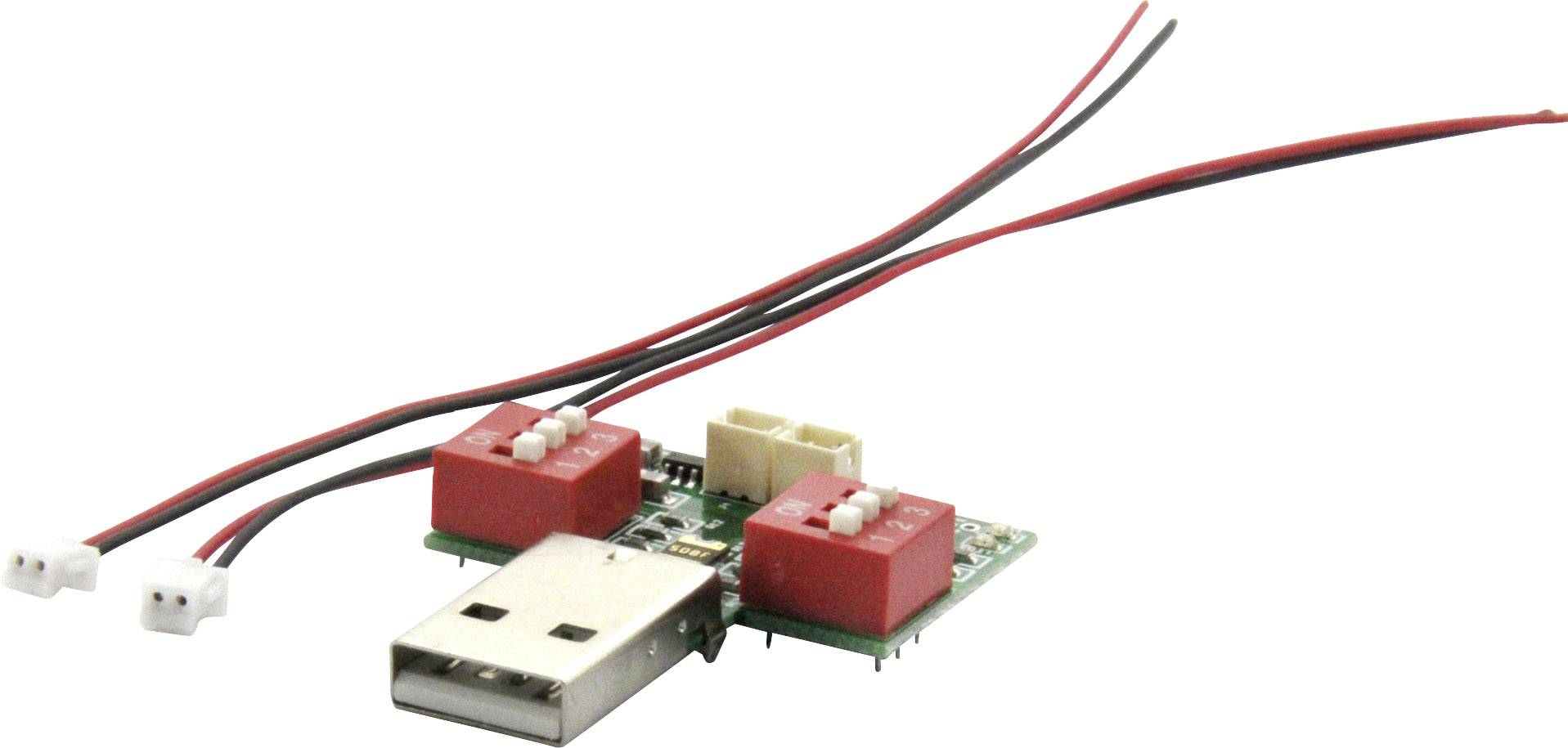USB zařízení se dvěma červenými tlačítky a dvěma připojenými kabely, které slouží k ovládání elektronických komponentů.