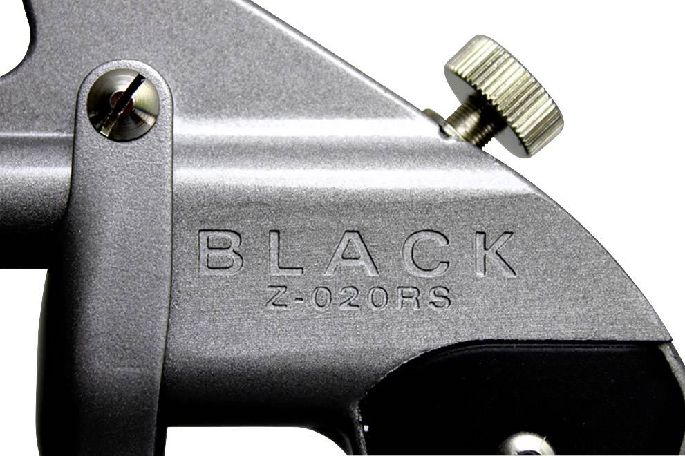 Stříbrné mechanické zařízení s nápisem 'BLACK Z-020RS', kovové tlačítko nahoře, šroub vlevo, detailní záběr.