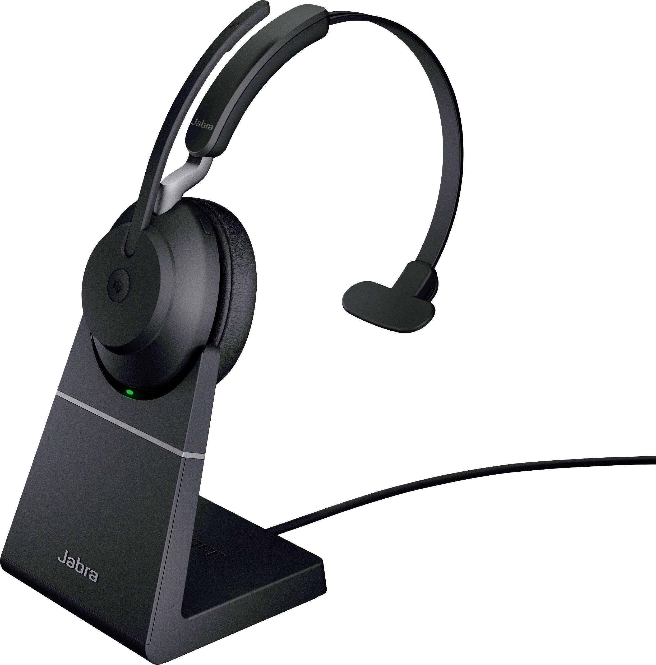 Headset s mikrofonem na tyči na nabíjecí stanici. Kabelové připojení. Značka: Jabra.