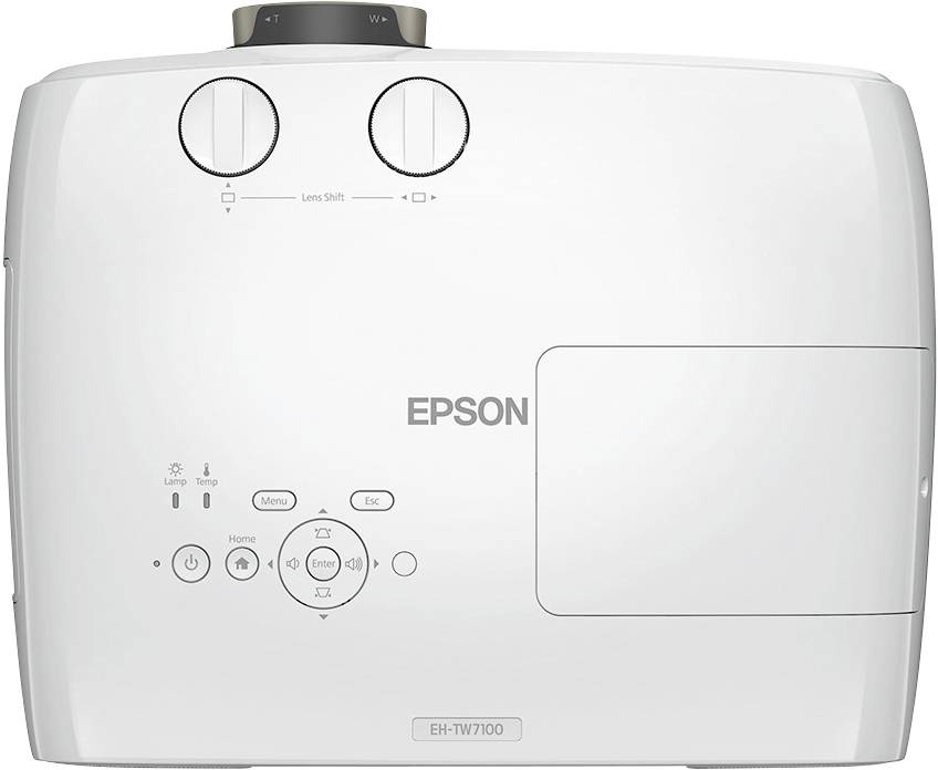 Projektor značky Epson, model EH-TW7100, s různými ovládacími tlačítky a konektory na horní straně.
