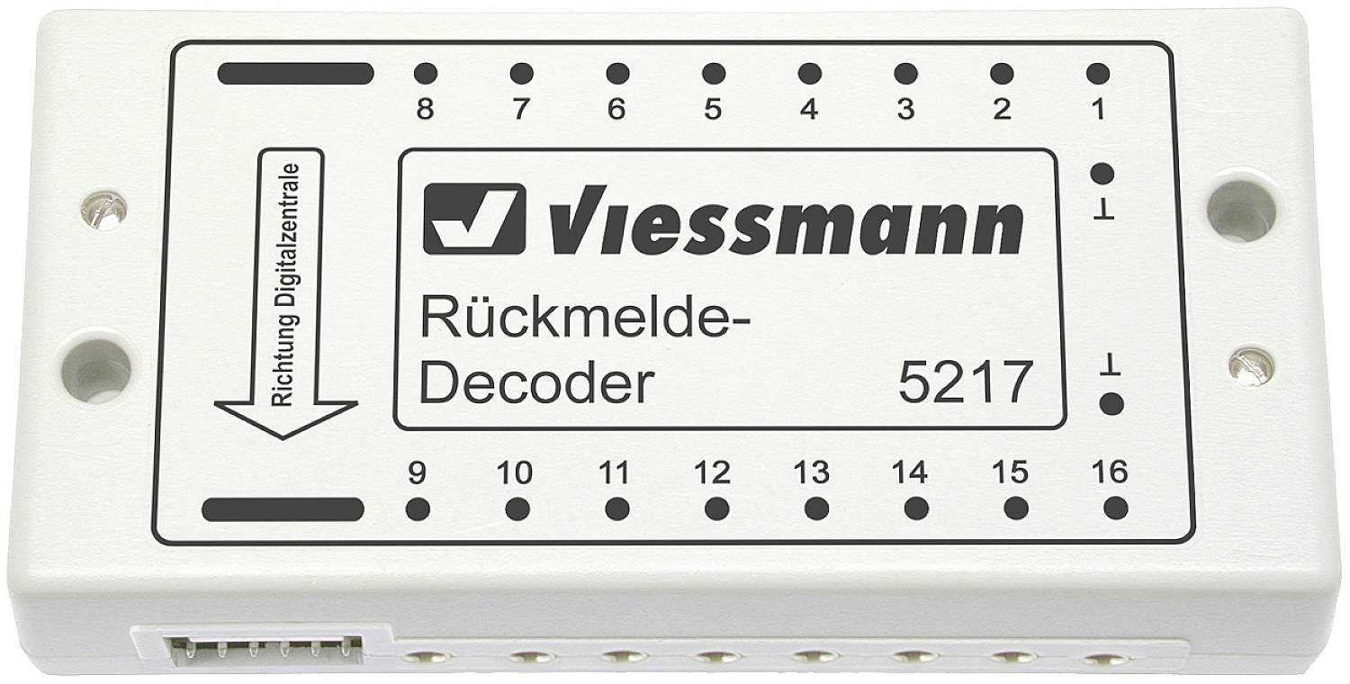 Obdélníkový elektrický dekodér zpětné vazby s rozhraními pro připojení, značka Viessmann, modelové číslo 5217, směrový šipka.