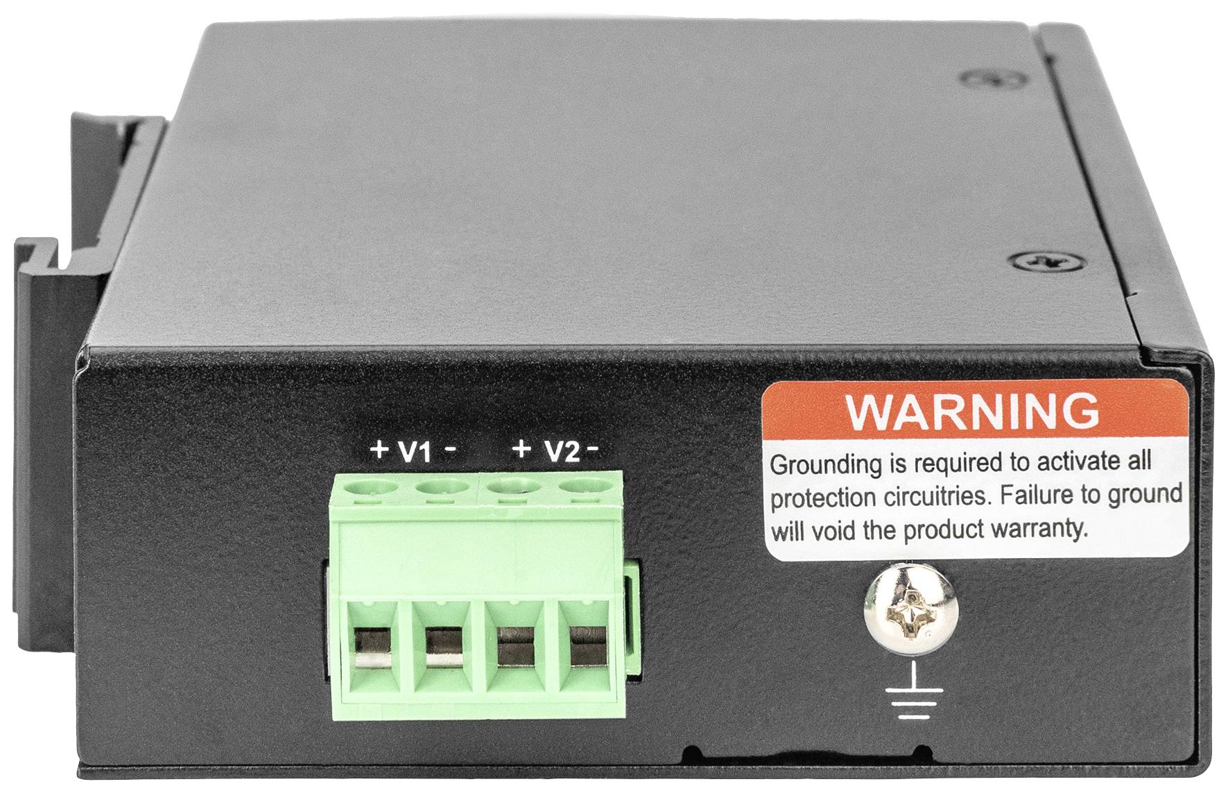 Černé elektronické zařízení se zeleným připojovacím blokem. Červený štítek upozorňuje: 'Uzemnění nutné pro aktivaci ochranných obvodů'.
