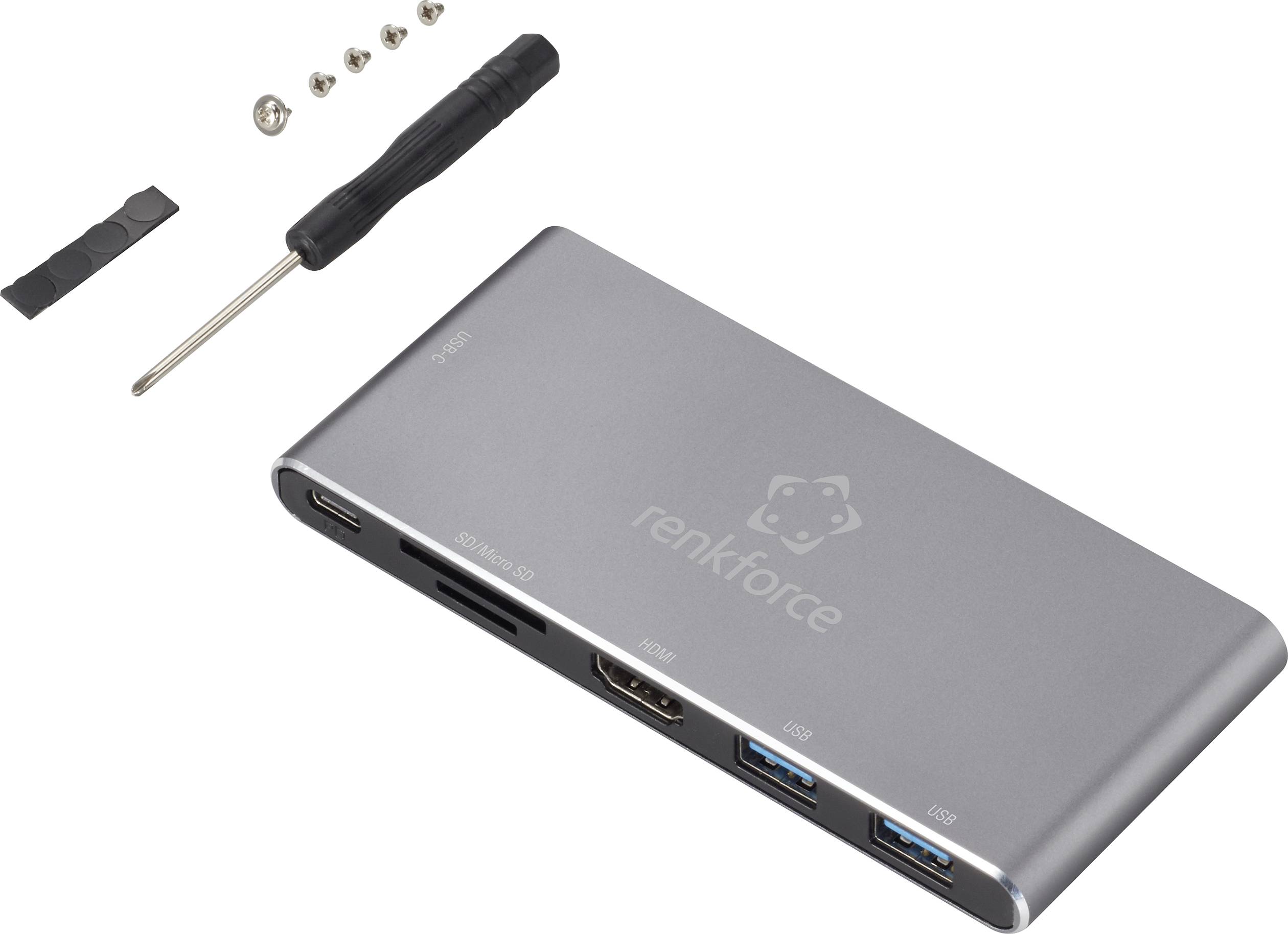 USB-C dokovací stanice s několika porty: HDMI, USB 3.0, USB 2.0, čtečka karet. Včetně šroubováku a šroubů.